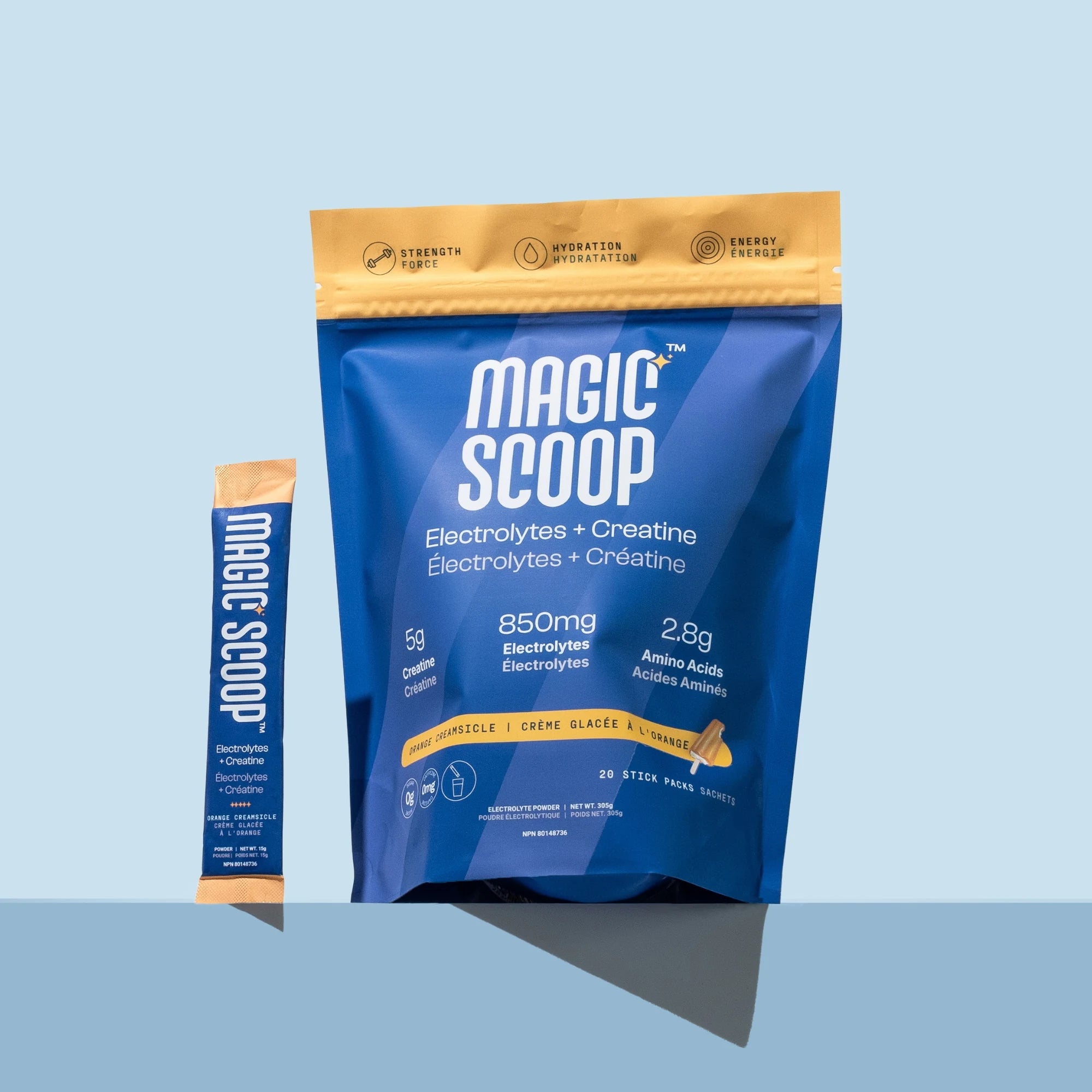 Magic Scoop Electrolytes + Creatine Orange Creamsicle Stick Packs pouch and single sachet on a light blue background